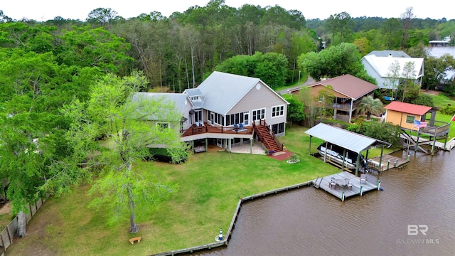 bird's eye view featuring a water view and a view of trees