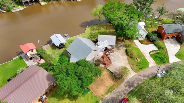 drone / aerial view with a water view and a residential view