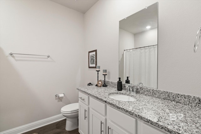 10487 Sand Dune Ave, Mobile, AL 36695 - full bathroom with wood finished floors, baseboards, toilet, vanity, and curtained shower