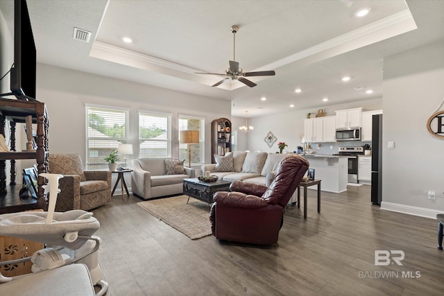 10487 Sand Dune Ave, Mobile, AL 36695 - living area with a raised ceiling, ornamental molding, dark wood-style floors, ceiling fan, and recessed lighting