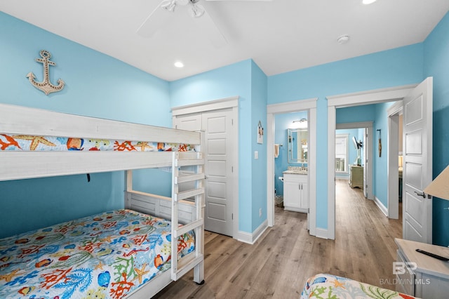 bedroom featuring light hardwood / wood-style flooring and ceiling fan