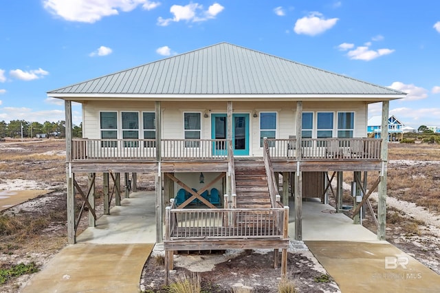 view of front of house featuring a carport and a porch