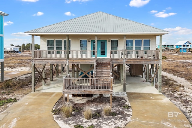 view of front of home featuring a carport and a porch