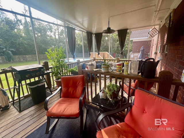 sunroom / solarium featuring plenty of natural light