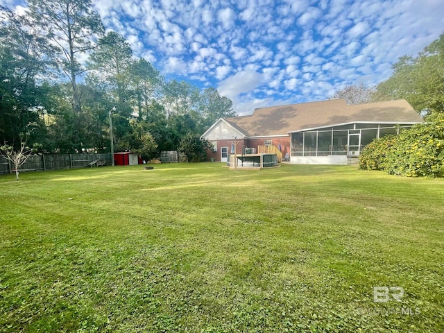 view of yard with a sunroom