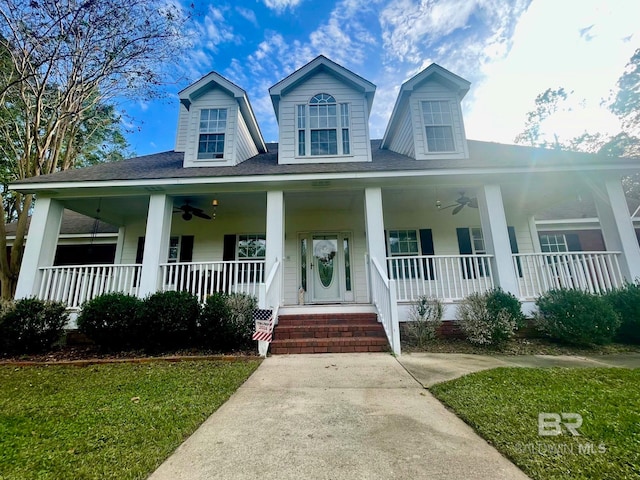 farmhouse featuring a porch and a front lawn