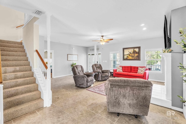 tiled living room featuring ceiling fan