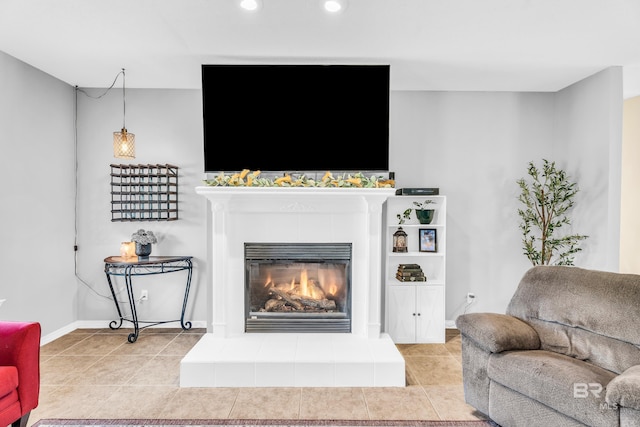 tiled living room featuring a tiled fireplace