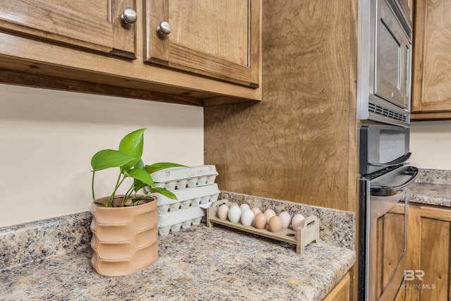 details with light stone counters and oven