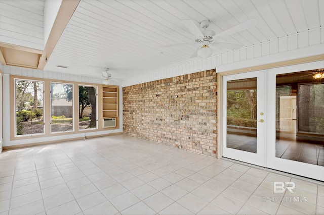 unfurnished sunroom featuring visible vents, french doors, cooling unit, and a ceiling fan