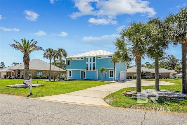 5553 Ponte Verde Rd, Pensacola, FL 32507 - coastal home featuring driveway and a front lawn