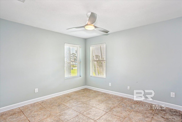 5553 Ponte Verde Rd, Pensacola, FL 32507 - spare room featuring baseboards, a ceiling fan, and light tile patterned flooring