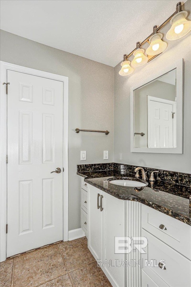 5553 Ponte Verde Rd, Pensacola, FL 32507 - bathroom with vanity, baseboards, and tile patterned flooring