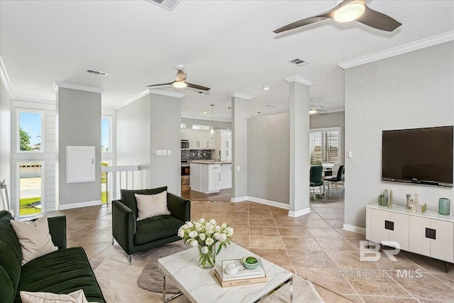 5553 Ponte Verde Rd, Pensacola, FL 32507 - living area with a ceiling fan, visible vents, crown molding, baseboards, and light tile patterned flooring