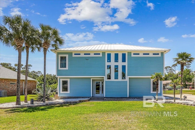 5553 Ponte Verde Rd, Pensacola, FL 32507 - view of front of property featuring a standing seam roof, cooling unit, metal roof, and a front yard