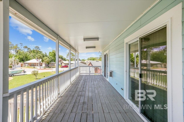 5553 Ponte Verde Rd, Pensacola, FL 32507 - wooden deck featuring a residential view