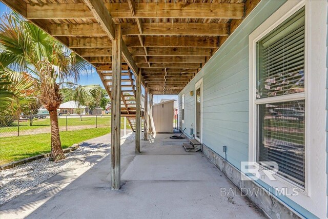5553 Ponte Verde Rd, Pensacola, FL 32507 - view of patio featuring fence and stairway