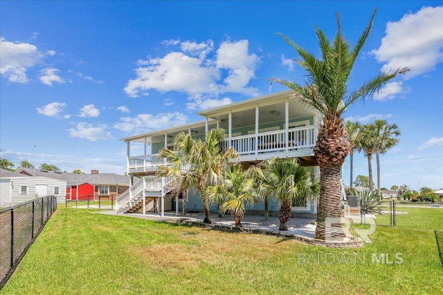 5553 Ponte Verde Rd, Pensacola, FL 32507 - back of property featuring a patio, a fenced backyard, stairs, a sunroom, and a lawn
