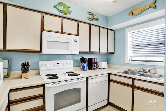24522 Perdido Beach Blvd Unit 4909, Orange Beach, AL 36561 - kitchen featuring white appliances, light countertops, and a textured ceiling
