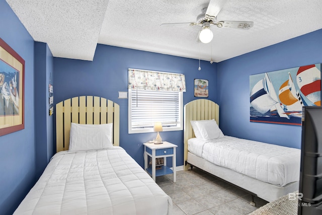 24522 Perdido Beach Blvd Unit 4909, Orange Beach, AL 36561 - tiled bedroom with a textured ceiling and ceiling fan