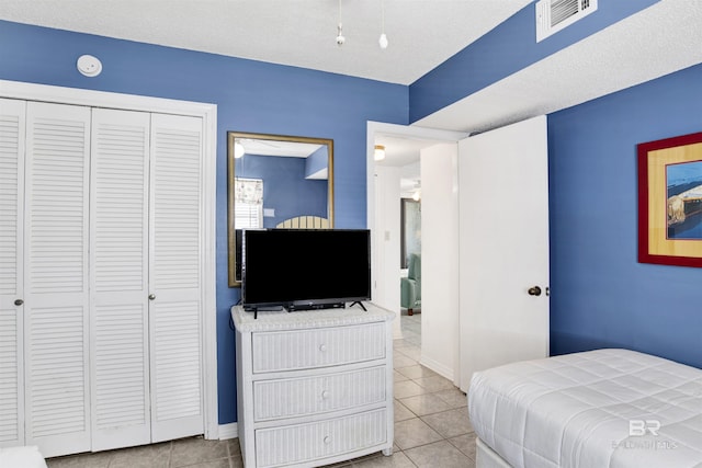 24522 Perdido Beach Blvd Unit 4909, Orange Beach, AL 36561 - bedroom with light tile patterned floors and a closet