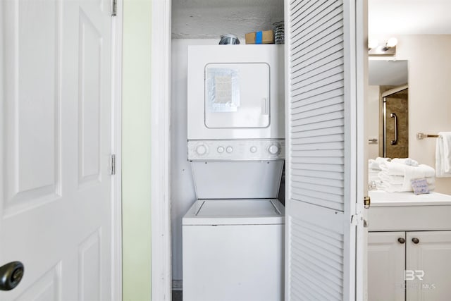 24522 Perdido Beach Blvd Unit 4909, Orange Beach, AL 36561 - laundry room featuring stacked washing machine and dryer