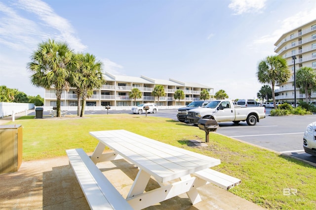 24522 Perdido Beach Blvd Unit 4909, Orange Beach, AL 36561 - view of property's community with uncovered parking and a lawn