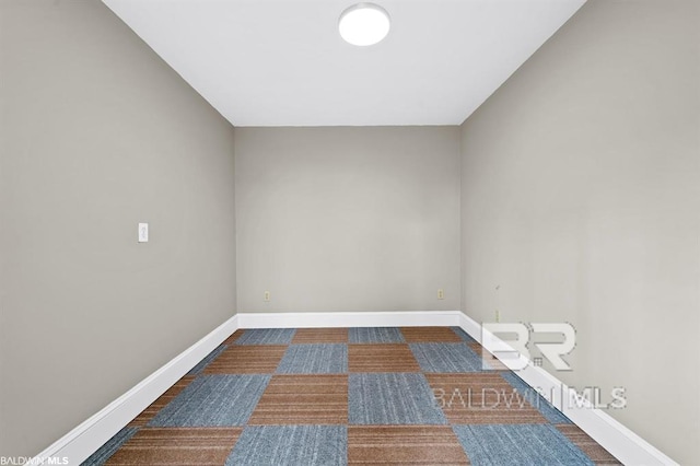 empty room with baseboards