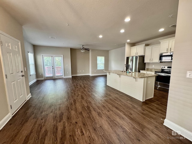 6811 Spaniel Dr Unit C, Spanish Fort, AL 36527 - kitchen featuring appliances with stainless steel finishes, a ceiling fan, plenty of natural light, white cabinetry, and recessed lighting