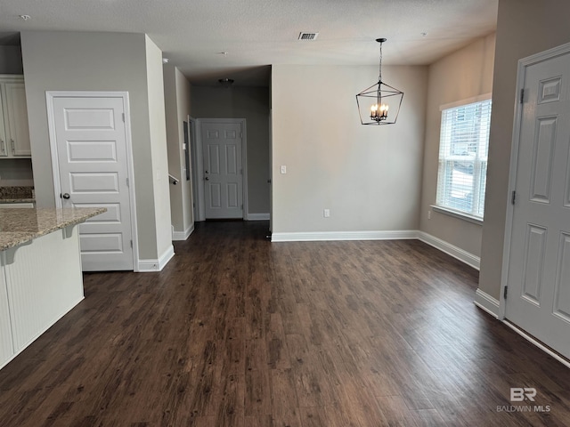 6811 Spaniel Dr Unit C, Spanish Fort, AL 36527 - unfurnished dining area with dark wood finished floors, a chandelier, and baseboards