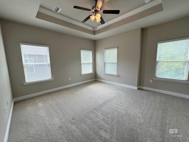 6811 Spaniel Dr Unit C, Spanish Fort, AL 36527 - carpeted empty room with a tray ceiling, crown molding, baseboards, and a ceiling fan