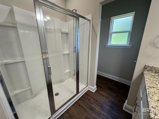 6811 Spaniel Dr Unit C, Spanish Fort, AL 36527 - bathroom featuring a shower stall, vanity, wood finished floors, and baseboards