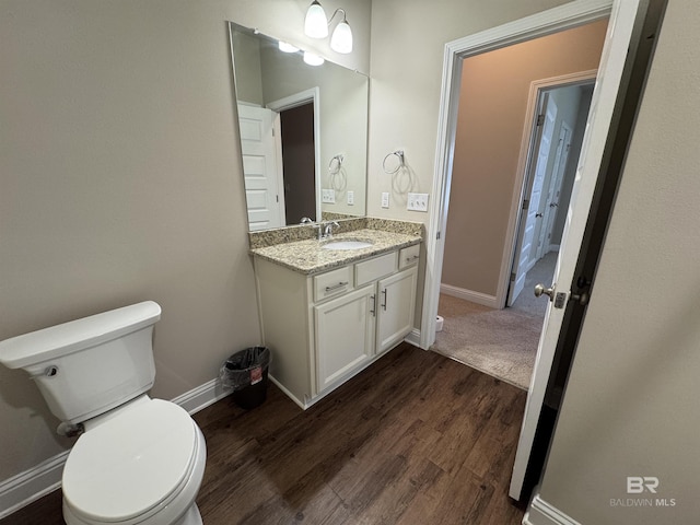 6811 Spaniel Dr Unit C, Spanish Fort, AL 36527 - bathroom with toilet, vanity, wood finished floors, and baseboards