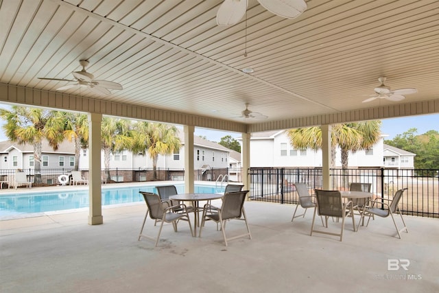 6811 Spaniel Dr Unit C, Spanish Fort, AL 36527 - view of patio / terrace featuring ceiling fan, outdoor dining area, and a community pool