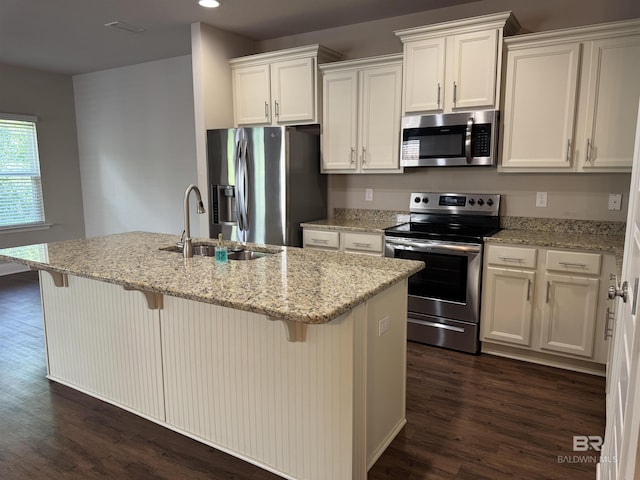 6811 Spaniel Dr Unit C, Spanish Fort, AL 36527 - kitchen with appliances with stainless steel finishes, a sink, white cabinetry, dark wood-style flooring, and recessed lighting