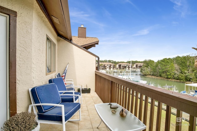 balcony featuring a water view