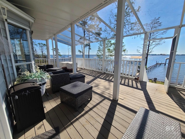 deck featuring a water view and outdoor lounge area