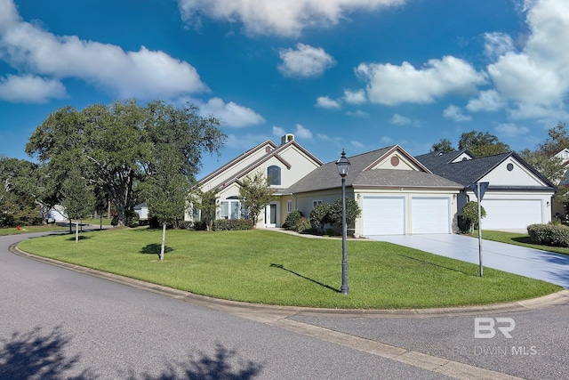 view of front of house featuring a front yard and a garage