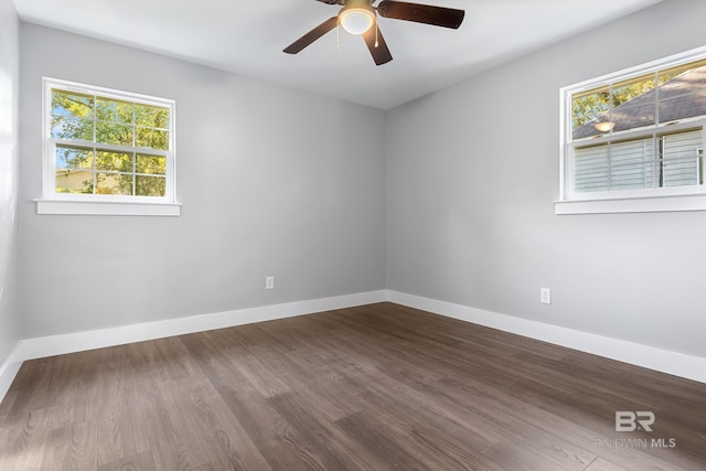 empty room featuring wood-type flooring and ceiling fan