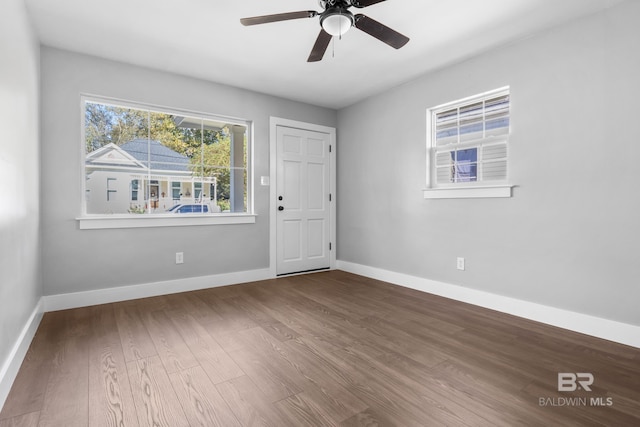 unfurnished room with wood-type flooring and ceiling fan