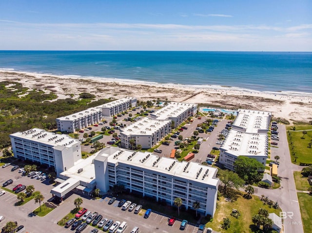 bird's eye view with a water view and a view of the beach