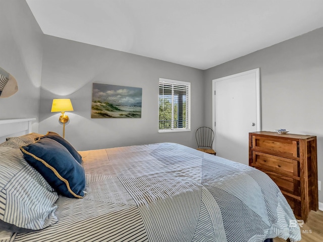 bedroom with light hardwood / wood-style flooring