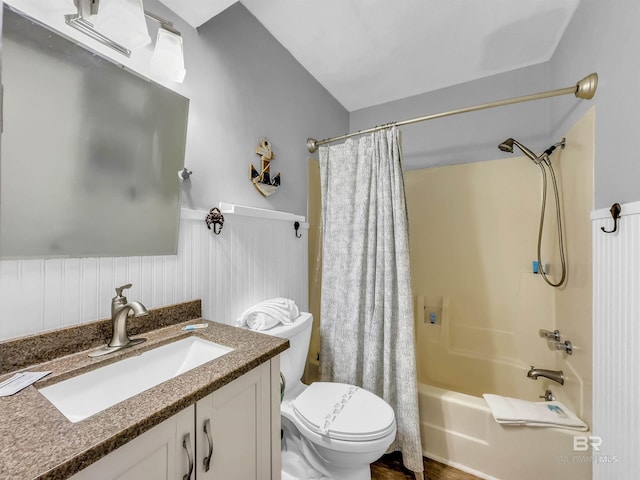 full bathroom with hardwood / wood-style flooring, vanity, toilet, and shower / tub combo with curtain