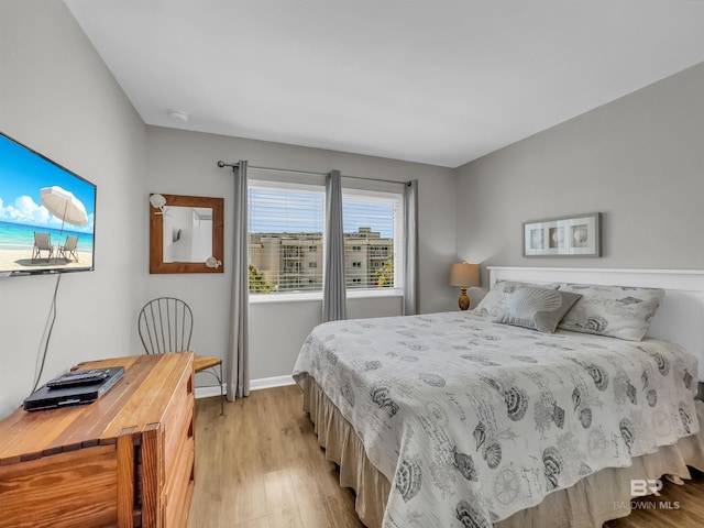 bedroom with light hardwood / wood-style flooring