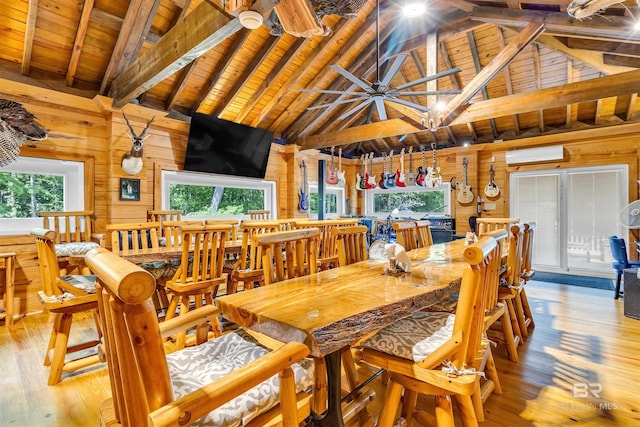42168 Bayou Rd, Bay Minette, AL 36507 - dining area featuring wooden walls, a wall unit AC, light wood-style flooring, a wood ceiling with exposed beams, and high vaulted ceiling