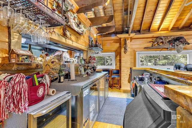 42168 Bayou Rd, Bay Minette, AL 36507 - bar area featuring a wooden ceiling with exposed beams, wood finished floors, plenty of natural light, wood walls, and beverage cooler