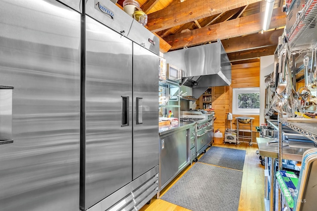 42168 Bayou Rd, Bay Minette, AL 36507 - kitchen featuring stainless steel fridge, wood finished floors, and a wood ceiling with exposed beams