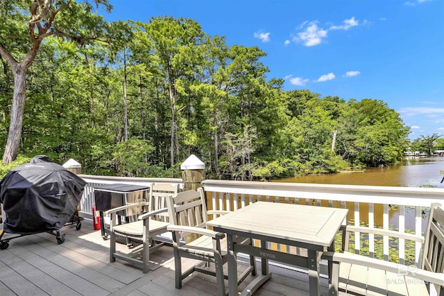 42168 Bayou Rd, Bay Minette, AL 36507 - wooden deck featuring a water view, grilling area, and outdoor dining space
