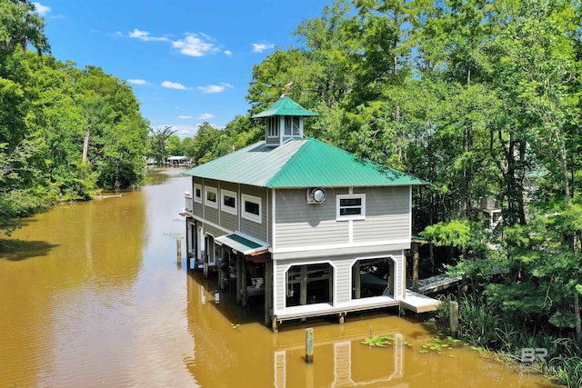 42168 Bayou Rd, Bay Minette, AL 36507 - rear view of house with a water view, a metal roof, and view of wooded area