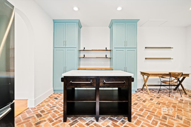 kitchen featuring blue cabinetry